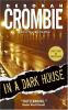 Book cover for "In a dark house".