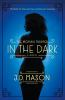 Book cover for "The woman trapped in the dark".