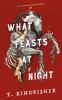 Book cover for "What feasts at night".