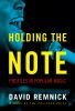 Book cover for "Holding the note"