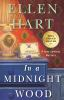 Book cover for "In a midnight wood".